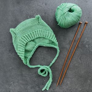 Ozoknit Baby bonnet hat with earflaps knitting pattern for newborns and babies